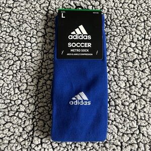 Size large adidas soccer socks. New with tag.
